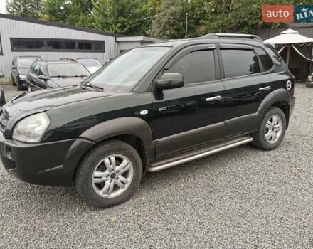 Зеленый Хендай Туксон, объемом двигателя 1.98 л и пробегом 363 тыс. км за 7400 $, фото 16 на Automoto.ua