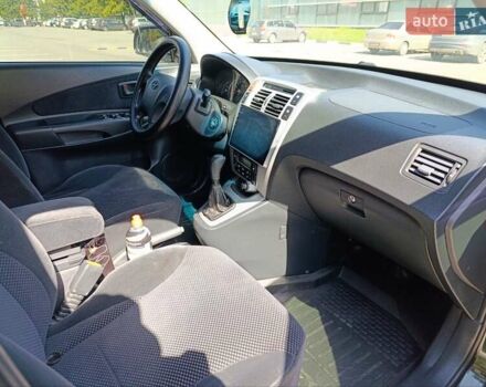 Зеленый Хендай Туксон, объемом двигателя 2 л и пробегом 203 тыс. км за 7800 $, фото 4 на Automoto.ua