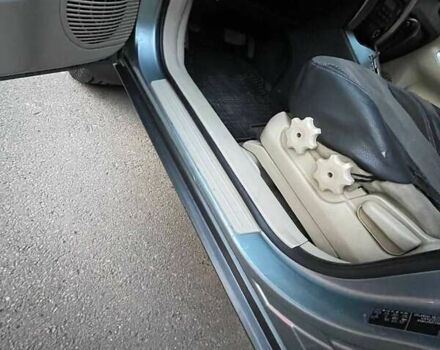 Зеленый Хендай Туксон, объемом двигателя 1.98 л и пробегом 205 тыс. км за 7700 $, фото 11 на Automoto.ua