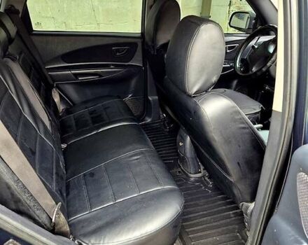 Зелений Хендай Туксон, об'ємом двигуна 2 л та пробігом 276 тис. км за 9000 $, фото 5 на Automoto.ua