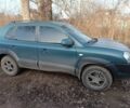 Зеленый Хендай Туксон, объемом двигателя 2 л и пробегом 250 тыс. км за 6000 $, фото 3 на Automoto.ua