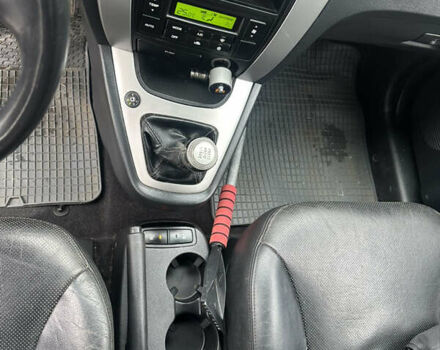 Зелений Хендай Туксон, об'ємом двигуна 2 л та пробігом 248 тис. км за 6999 $, фото 12 на Automoto.ua