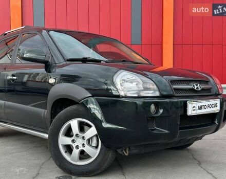 Зеленый Хендай Туксон, объемом двигателя 1.99 л и пробегом 214 тыс. км за 7990 $, фото 1 на Automoto.ua