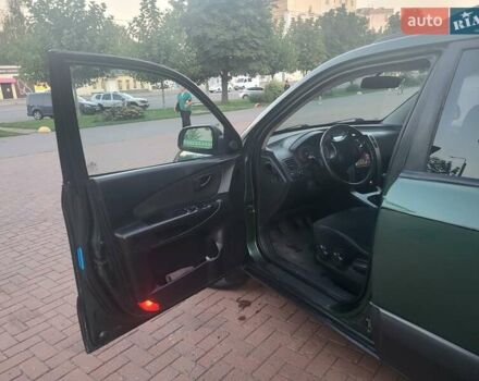 Зеленый Хендай Туксон, объемом двигателя 2 л и пробегом 225 тыс. км за 6100 $, фото 8 на Automoto.ua