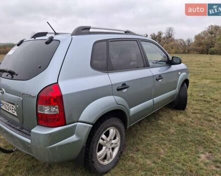 Зеленый Хендай Туксон, объемом двигателя 1.98 л и пробегом 129 тыс. км за 9200 $, фото 1 на Automoto.ua