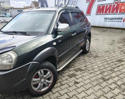 Зелений Хендай Туксон, об'ємом двигуна 1.98 л та пробігом 245 тис. км за 7800 $, фото 17 на Automoto.ua