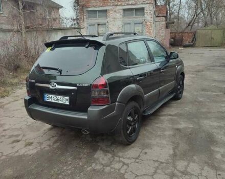 Зеленый Хендай Туксон, объемом двигателя 2 л и пробегом 213 тыс. км за 6500 $, фото 3 на Automoto.ua
