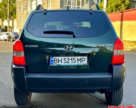 Зеленый Хендай Туксон, объемом двигателя 2 л и пробегом 172 тыс. км за 7000 $, фото 2 на Automoto.ua