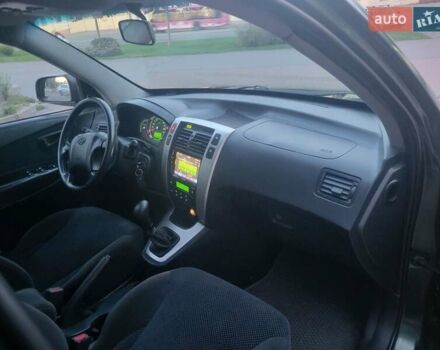 Зеленый Хендай Туксон, объемом двигателя 2 л и пробегом 225 тыс. км за 6100 $, фото 21 на Automoto.ua
