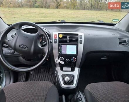 Зеленый Хендай Туксон, объемом двигателя 1.98 л и пробегом 129 тыс. км за 9200 $, фото 12 на Automoto.ua