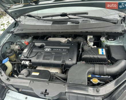 Зелений Хендай Туксон, об'ємом двигуна 2 л та пробігом 248 тис. км за 6999 $, фото 16 на Automoto.ua