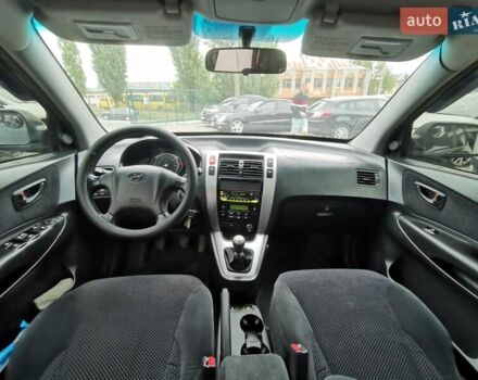 Зеленый Хендай Туксон, объемом двигателя 1.98 л и пробегом 363 тыс. км за 7400 $, фото 26 на Automoto.ua