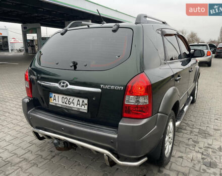 Зеленый Хендай Туксон, объемом двигателя 1.98 л и пробегом 295 тыс. км за 5950 $, фото 6 на Automoto.ua