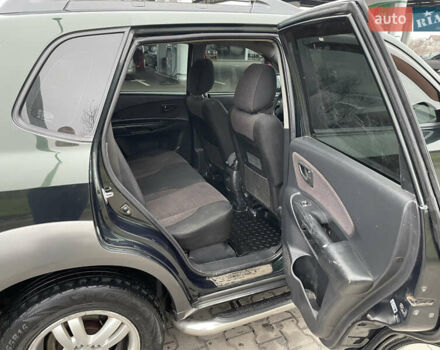 Зеленый Хендай Туксон, объемом двигателя 1.98 л и пробегом 295 тыс. км за 5950 $, фото 20 на Automoto.ua