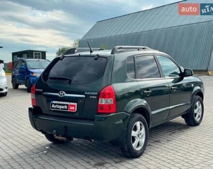 Зеленый Хендай Туксон, объемом двигателя 2 л и пробегом 302 тыс. км за 6990 $, фото 4 на Automoto.ua
