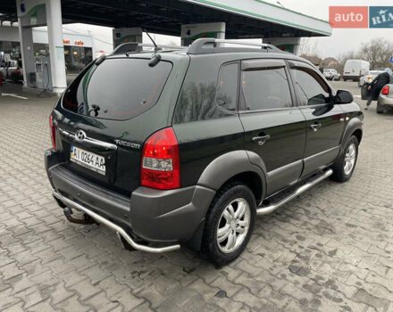 Зеленый Хендай Туксон, объемом двигателя 1.98 л и пробегом 295 тыс. км за 5950 $, фото 31 на Automoto.ua