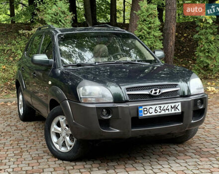 Зеленый Хендай Туксон, объемом двигателя 1.98 л и пробегом 230 тыс. км за 7999 $, фото 2 на Automoto.ua
