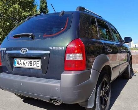 Зеленый Хендай Туксон, объемом двигателя 1.98 л и пробегом 200 тыс. км за 7000 $, фото 3 на Automoto.ua