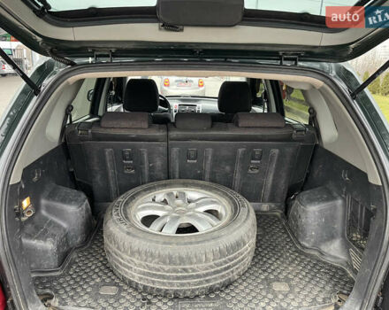 Зеленый Хендай Туксон, объемом двигателя 1.98 л и пробегом 295 тыс. км за 5950 $, фото 19 на Automoto.ua