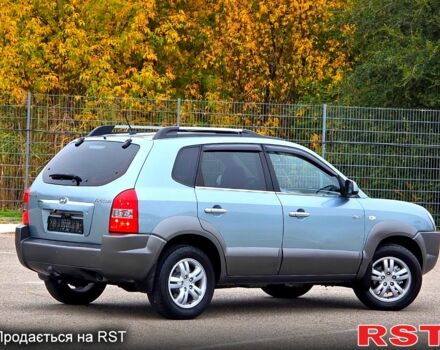 Зеленый Хендай Туксон, объемом двигателя 2 л и пробегом 115 тыс. км за 9700 $, фото 1 на Automoto.ua