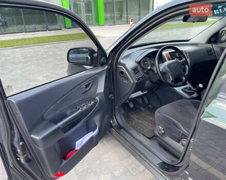 Зеленый Хендай Туксон, объемом двигателя 1.98 л и пробегом 180 тыс. км за 9200 $, фото 11 на Automoto.ua