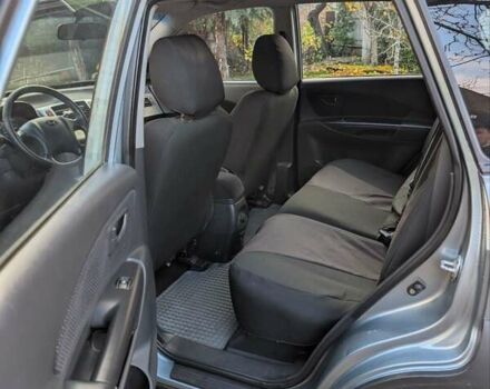 Зеленый Хендай Туксон, объемом двигателя 1.98 л и пробегом 200 тыс. км за 8000 $, фото 7 на Automoto.ua