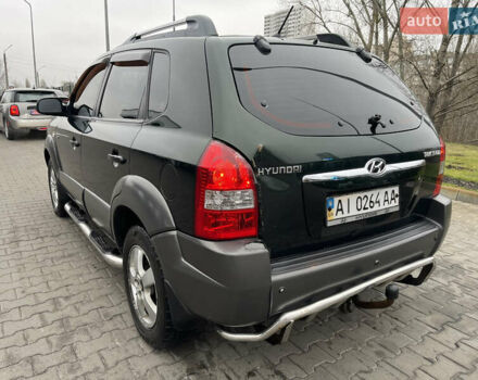 Зеленый Хендай Туксон, объемом двигателя 1.98 л и пробегом 295 тыс. км за 5950 $, фото 4 на Automoto.ua