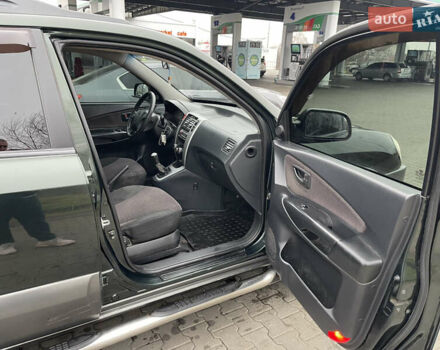 Зеленый Хендай Туксон, объемом двигателя 1.98 л и пробегом 295 тыс. км за 5950 $, фото 24 на Automoto.ua