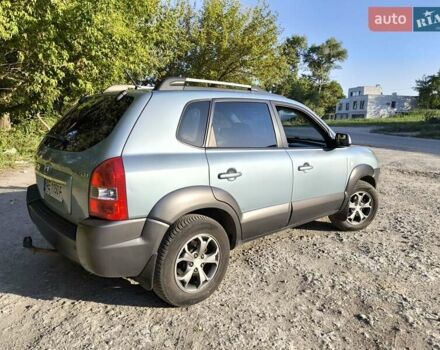 Зелений Хендай Туксон, об'ємом двигуна 2 л та пробігом 240 тис. км за 8500 $, фото 7 на Automoto.ua