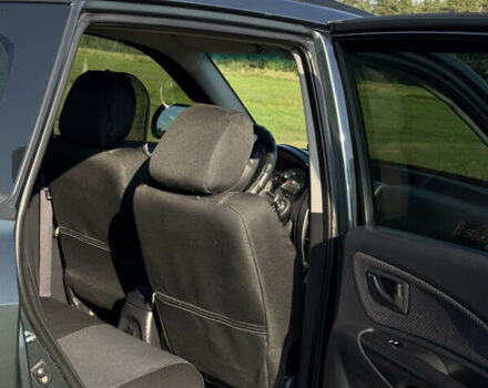 Зеленый Хендай Туксон, объемом двигателя 1.98 л и пробегом 180 тыс. км за 9999 $, фото 7 на Automoto.ua