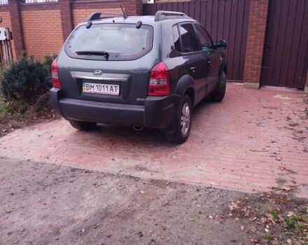 Зеленый Хендай Туксон, объемом двигателя 1.98 л и пробегом 146 тыс. км за 10000 $, фото 2 на Automoto.ua