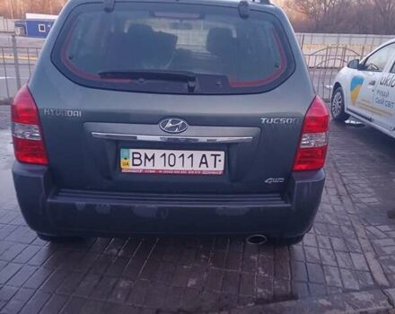 Зеленый Хендай Туксон, объемом двигателя 1.98 л и пробегом 146 тыс. км за 10000 $, фото 4 на Automoto.ua
