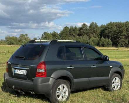 Зеленый Хендай Туксон, объемом двигателя 1.98 л и пробегом 180 тыс. км за 9999 $, фото 4 на Automoto.ua