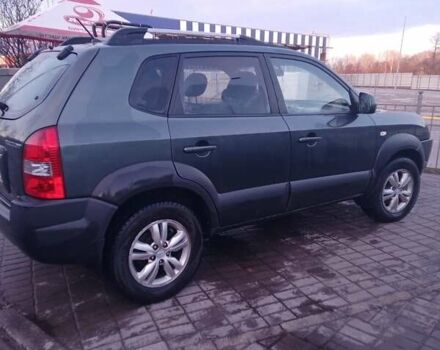 Зеленый Хендай Туксон, объемом двигателя 1.98 л и пробегом 146 тыс. км за 10000 $, фото 10 на Automoto.ua