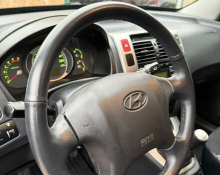 Зеленый Хендай Туксон, объемом двигателя 2 л и пробегом 65 тыс. км за 12250 $, фото 55 на Automoto.ua