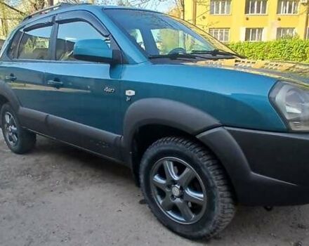 Зеленый Хендай Туксон, объемом двигателя 1.98 л и пробегом 288 тыс. км за 6500 $, фото 1 на Automoto.ua