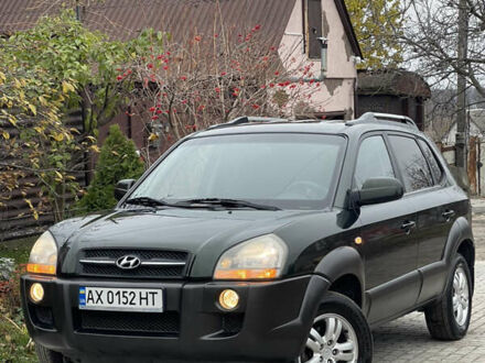 Зеленый Хендай Туксон, объемом двигателя 1.98 л и пробегом 261 тыс. км за 7499 $, фото 1 на Automoto.ua