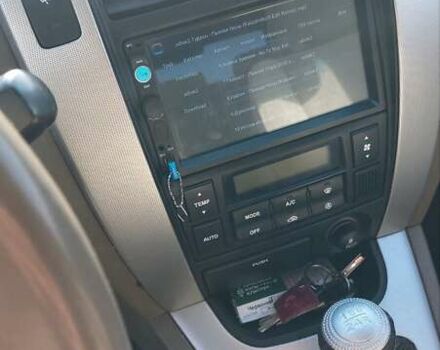 Зеленый Хендай Туксон, объемом двигателя 2 л и пробегом 138 тыс. км за 8500 $, фото 1 на Automoto.ua