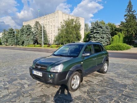 Зеленый Хендай Туксон, объемом двигателя 2 л и пробегом 226 тыс. км за 6499 $, фото 1 на Automoto.ua