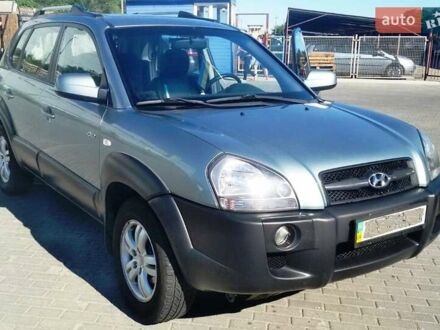 Зеленый Хендай Туксон, объемом двигателя 2 л и пробегом 234 тыс. км за 9000 $, фото 1 на Automoto.ua