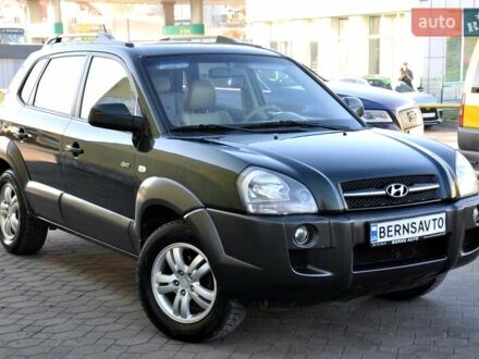 Зеленый Хендай Туксон, объемом двигателя 1.98 л и пробегом 245 тыс. км за 7200 $, фото 1 на Automoto.ua