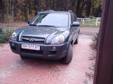 Зеленый Хендай Туксон, объемом двигателя 1.98 л и пробегом 146 тыс. км за 10000 $, фото 1 на Automoto.ua