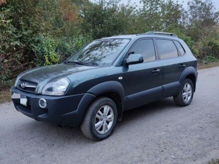 Зеленый Хендай Туксон, объемом двигателя 2 л и пробегом 97 тыс. км за 9600 $, фото 1 на Automoto.ua