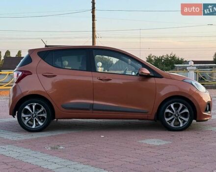 Помаранчевий Хендай і10, об'ємом двигуна 1.2 л та пробігом 150 тис. км за 7999 $, фото 1 на Automoto.ua
