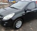 Черный Хендай и20, объемом двигателя 1.25 л и пробегом 170 тыс. км за 4900 $, фото 1 на Automoto.ua