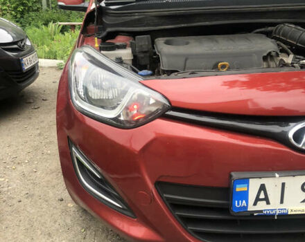 Красный Хендай и20, объемом двигателя 1.4 л и пробегом 167 тыс. км за 6600 $, фото 1 на Automoto.ua