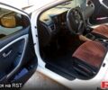 Білий Хендай i30, об'ємом двигуна 1.4 л та пробігом 206 тис. км за 8790 $, фото 5 на Automoto.ua