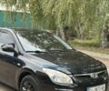 Черный Хендай i30, объемом двигателя 1.6 л и пробегом 240 тыс. км за 5999 $, фото 1 на Automoto.ua