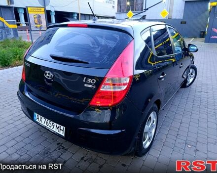 Черный Хендай i30, объемом двигателя 1.4 л и пробегом 170 тыс. км за 5800 $, фото 4 на Automoto.ua