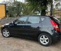 Черный Хендай i30, объемом двигателя 1.4 л и пробегом 275 тыс. км за 5100 $, фото 1 на Automoto.ua